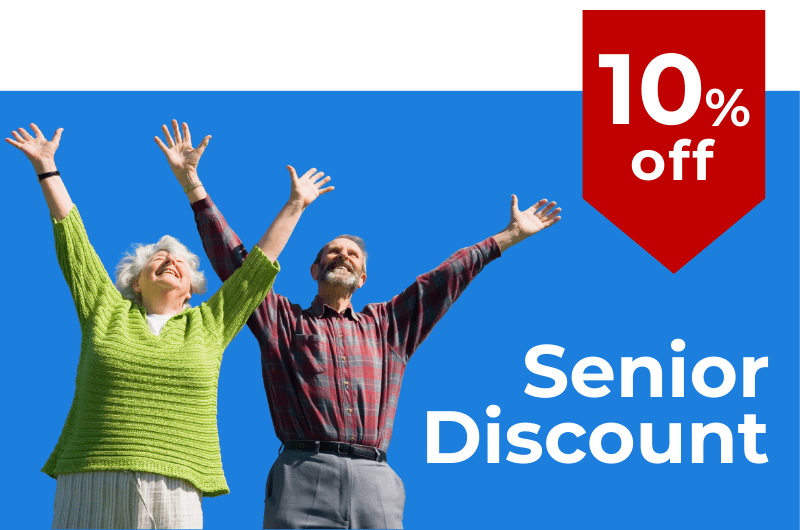 Happy senior couple celebrating with arms raised showcasing a 10 senior discount for maintenance and repair services in Homestead Fl Hand It To Us Handyman Services