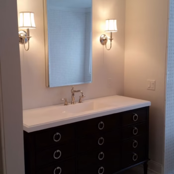 Expert handyman services for modern bathroom remodels in Miami, Florida Handyman bathroom remodeling services in Miami with modern vanity, mirror, and lighting