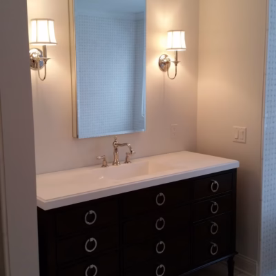 Expert handyman services for modern bathroom remodels in Miami, Florida Handyman bathroom remodeling services in Miami with modern vanity, mirror, and lighting